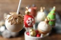 Delicious Christmas ball cake pop on blurred background, closeup Royalty Free Stock Photo