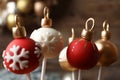 Delicious Christmas ball cake pops on blurred background, closeup Royalty Free Stock Photo