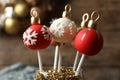 Delicious Christmas ball cake pops on background, closeup Royalty Free Stock Photo