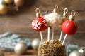 Delicious Christmas ball cake pops on blurred background, closeup Royalty Free Stock Photo