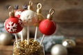 Delicious Christmas ball cake pops on blurred background, closeup Royalty Free Stock Photo