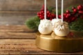 Delicious Christmas ball cake pops on wooden table. Space for text Royalty Free Stock Photo