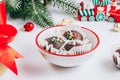 Delicious Christmas Candy sprinkle red-green-white balls served in a white bowl over white background. Royalty Free Stock Photo