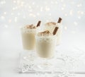 Delicious Christmas cocktail eggnog with whipped cream and cinnamon Royalty Free Stock Photo