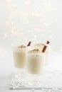 Delicious Christmas cocktail eggnog with whipped cream and cinnamon Royalty Free Stock Photo