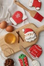 Delicious Christmas cookies and ingredients on white wooden table, flat lay Royalty Free Stock Photo