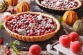 Delicious Christmas cranberry tart and festive decoration close-up. Horizontal