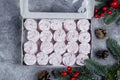 Delicious christmas dessert with festive decoration. Homemade marshmallow or zephyr in box Royalty Free Stock Photo