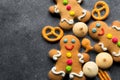 Delicious Christmas gingerbread men.Christmas baking ingredients and supplies on dark background.Postcard. Congratulation.Cooking Royalty Free Stock Photo