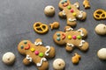 Delicious Christmas gingerbread men.Christmas baking ingredients and supplies on dark background.Postcard. Congratulation.Cooking Royalty Free Stock Photo