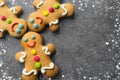 Delicious Christmas gingerbread men.Christmas baking ingredients and supplies on dark background.Postcard. Congratulation.Cooking Royalty Free Stock Photo