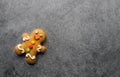 Delicious Christmas gingerbread men.Christmas baking ingredients and supplies on dark background.Postcard. Congratulation.Cooking Royalty Free Stock Photo