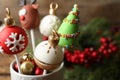 Delicious Christmas themed cake pops on blurred background, closeup Royalty Free Stock Photo