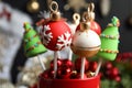 Delicious Christmas themed cake pops on blurred  background, closeup Royalty Free Stock Photo