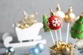 Delicious Christmas cake pops on blurred  background, closeup. Space for text Royalty Free Stock Photo