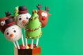 Delicious Christmas themed cake pops on green background, closeup. Space for text Royalty Free Stock Photo