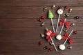 Delicious Christmas themed cake pops on wooden table, flat lay. Space for text Royalty Free Stock Photo