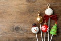 Delicious Christmas themed cake pops on table, flat lay. Space for text Royalty Free Stock Photo