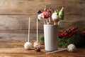 Delicious Christmas themed cake pops on wooden table. Space for text Royalty Free Stock Photo