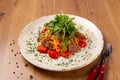 Delicious classic Italian spaghetti La Carne with tomatoes and arugula