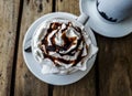 Delicious coffee cups filled with creamy coffee on a restaurant table showing cafe moca and cafe latte.