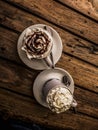 Delicious coffee cups filled with creamy coffee on a restaurant table showing cafe moca and cafe latte.