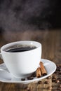 Delicious coffee with sweets on a wooden table