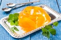 Delicious cold jelly with slices of orange and fresh mint