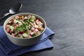 Delicious okroshka with kvass served on black table, space for text. Traditional Russian summer soup Royalty Free Stock Photo