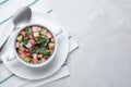 Delicious cold okroshka with kvass served on grey table, top view and space for text. Traditional Russian summer soup Royalty Free Stock Photo