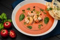 Delicious cold tomato soup or gazpacho with shrimps