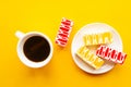 Delicious color cakes on a plate and coffee cup, top view. Royalty Free Stock Photo