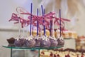 Delicious colorful cookies and cakes on the wedding candy bar.