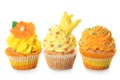 Delicious colorful cupcakes on white background