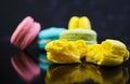 Delicious colorful macaron cakes on dark background Royalty Free Stock Photo