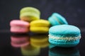 Delicious colorful macaron cakes on dark background Royalty Free Stock Photo
