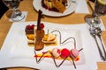 Delicious colourful ice creams with fresh strawberry and cherries, chocolate violin and spirals