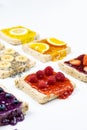 Delicious colourful minimal mix fruits jam on sliced bread. Set on white background Royalty Free Stock Photo