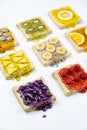 Delicious colourful minimal mix fruits jam on sliced bread. Set on white background Royalty Free Stock Photo