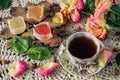 Delicious ,colourful retro dessert of marmalade and a Cup of rose hip tea