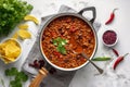 Delicious cooked chili con carne beef stew with beans in thick tomato sauce with vegetables. Traditional Texas specialty Royalty Free Stock Photo