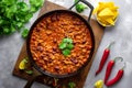 Delicious cooked chili con carne beef stew with beans in thick tomato sauce with vegetables. Traditional Texas specialty