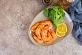 Delicious cooked shrimps in plate isolated on grey background. Boiled prawns Royalty Free Stock Photo
