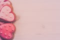 Delicious cookies in the shape of a heart on a wooden background. Royalty Free Stock Photo