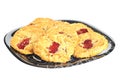 Delicious cookies with strawberry jam on a plate, on white background