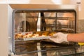 Delicious cookies in a tray put inside of a modern and useful commercial Bread Baking Oven Royalty Free Stock Photo