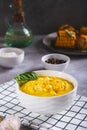 Delicious corn cream soup in a bowl on the table vertical view Royalty Free Stock Photo