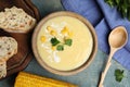 Delicious corn cream soup served on blue wooden table, flat lay Royalty Free Stock Photo