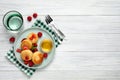 Delicious cottage cheese pancakes with fresh berries and honey on white wooden table, flat lay. Space for text Royalty Free Stock Photo