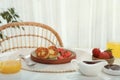Delicious cottage cheese pancakes with fresh strawberries served on white table indoors Royalty Free Stock Photo